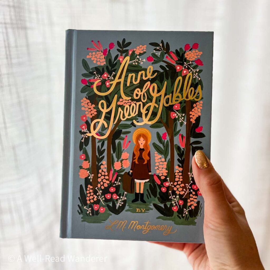 anne of green gables by lm montgomery held by polished hand cozy books to read