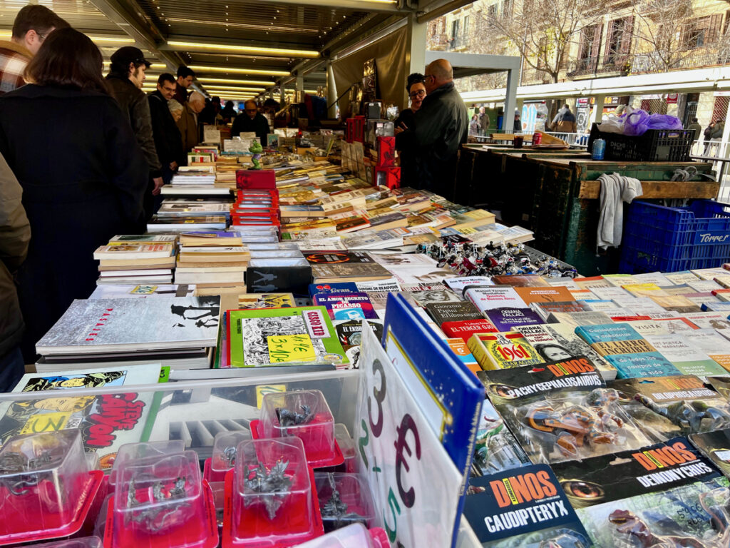 used books on a vendor table at the barcelona book market on sundays