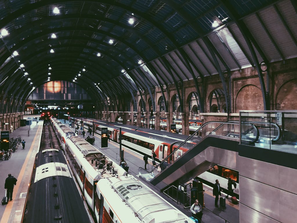 kings cross station harry potter attractions in london view of train with round roof and people walking to trains