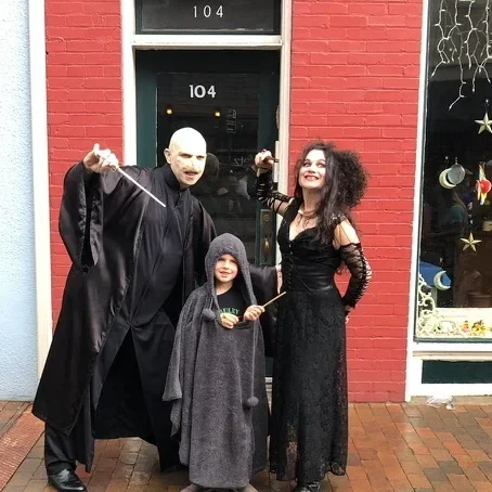voldemort and bellatrix lestrange costumed characters with child at staunton harry potter festival