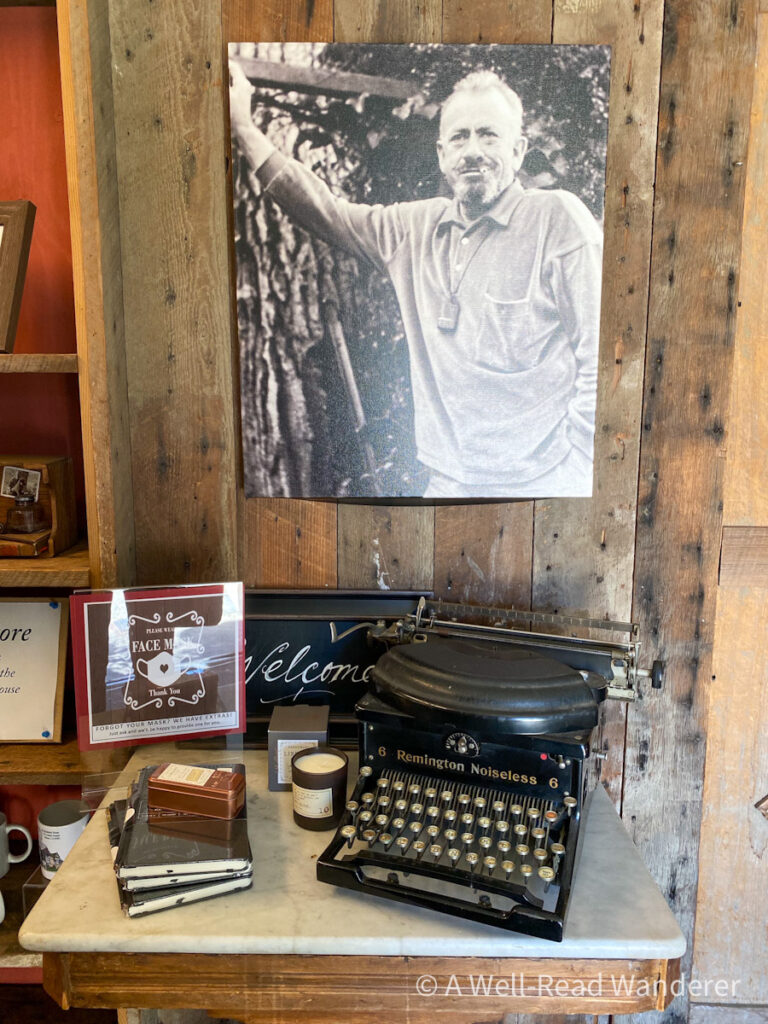 antique typewriter and a photograph of john steinbeck