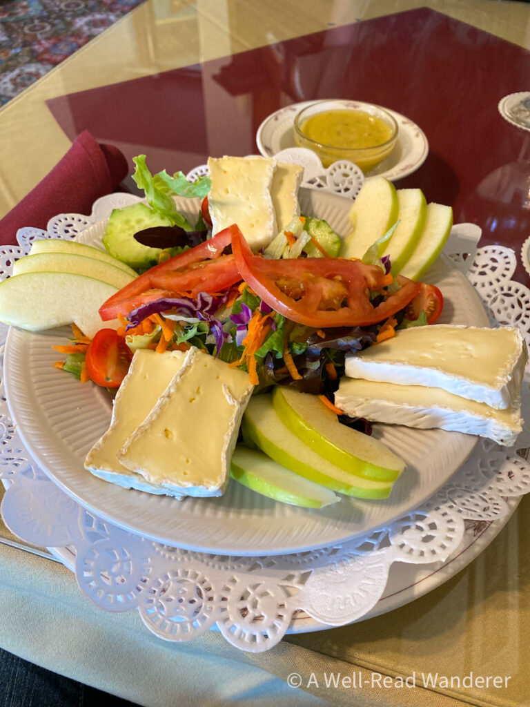 delicious salad at the steinbeck house restaurant, dressing on the side, large wedges of cheese and vegetables