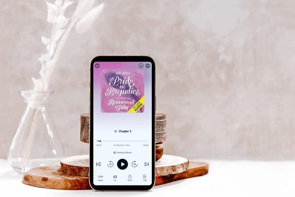 pride and prejudice audiobook narrated by rosamund pike on a phone on a table