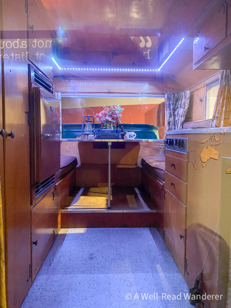 interior of a camper van with a typewriter on the dining room table, rocinante, john steinbeck's camper