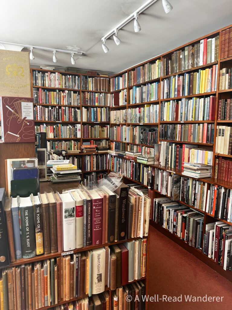 interior of bow windows bookshop, dark wood shelves filled with antiquarian books