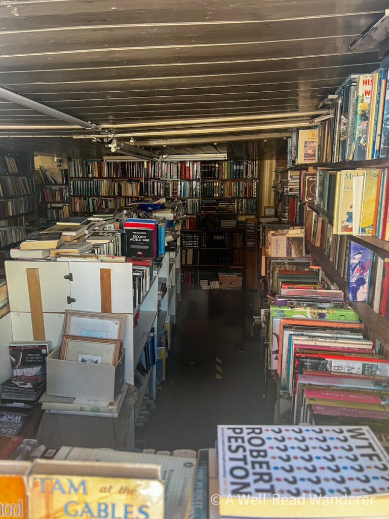 interior of fifteenth century bookshop in lewes, stacks of books in neat rows