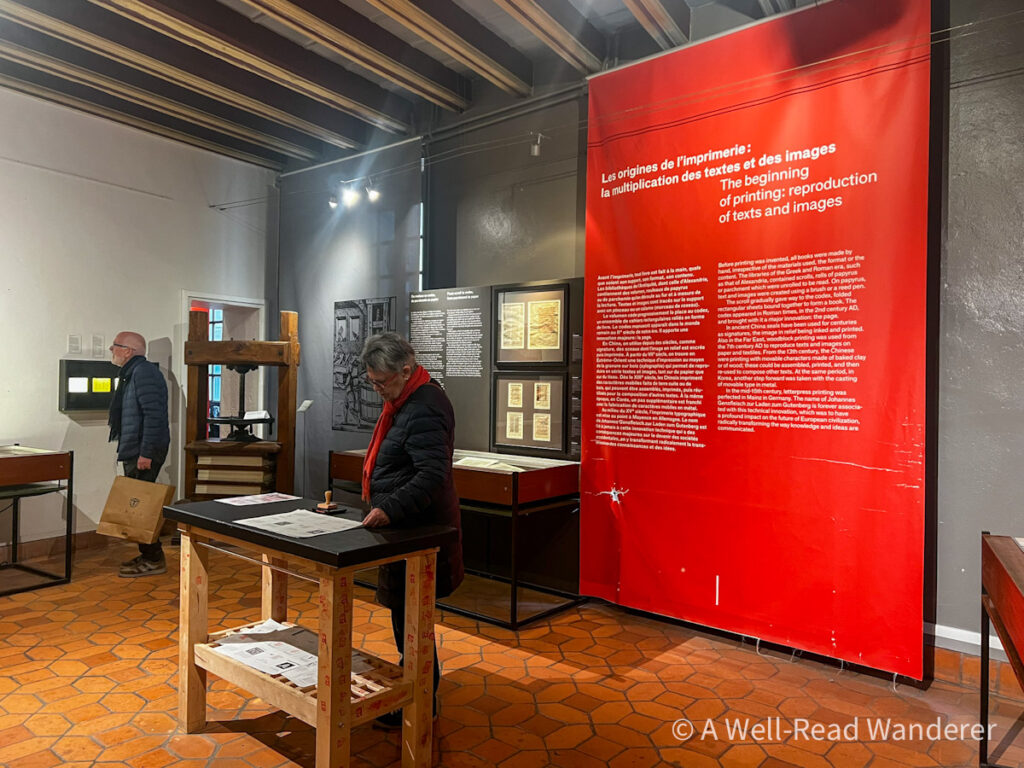 interior of lyon musee de l'imprimeree or book printing museum with a book printing press on display