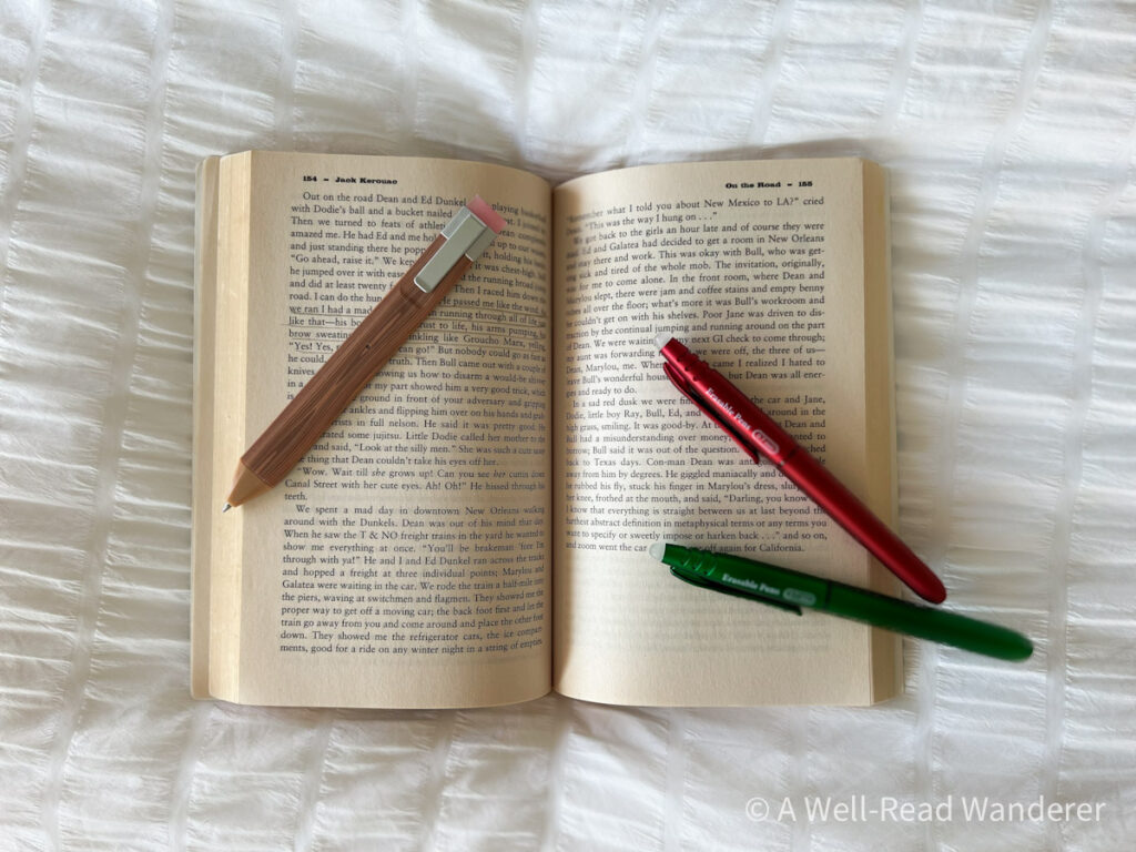 open book with pens around it for annotating