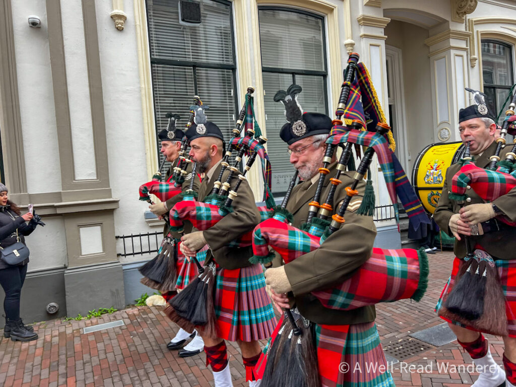 scottish bagpipers lead a parade at the deventer dickens festijn