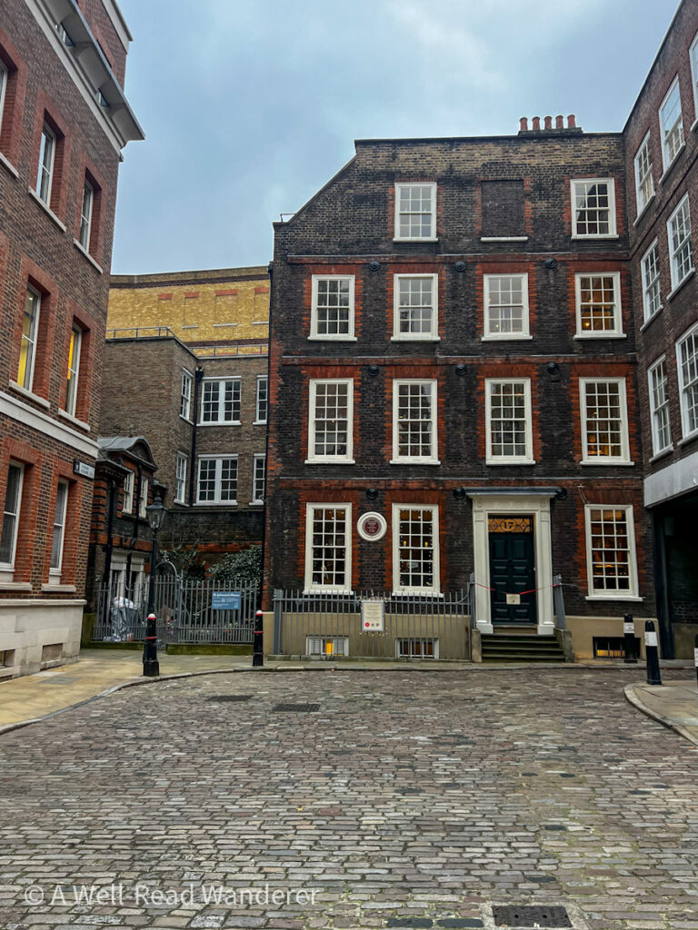 exterior of red brick building with white trimmed windows in a historic square in london the exterior of dr johnson's house london