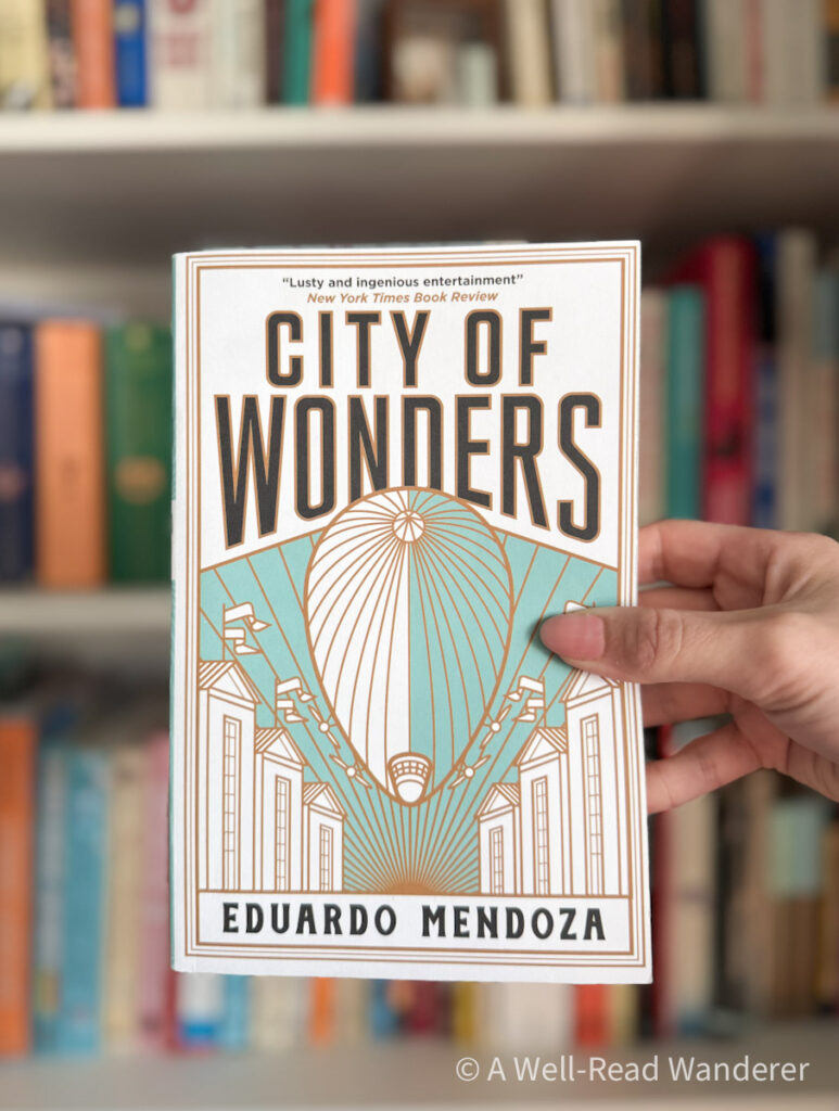 city of wonders by eduardo mendoza novel held by manicured hand in front of bookshelf a novel set in Barcelona