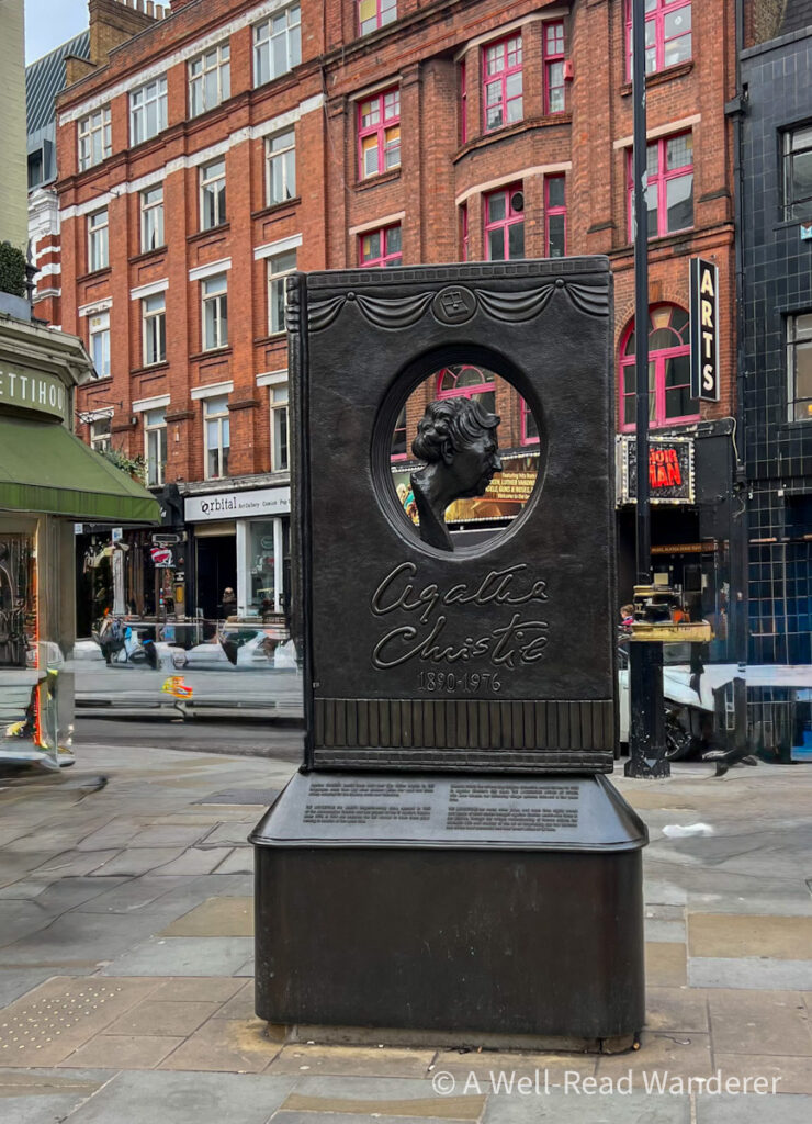 agatha christie memorial in london a bronze upright book with her head in the center