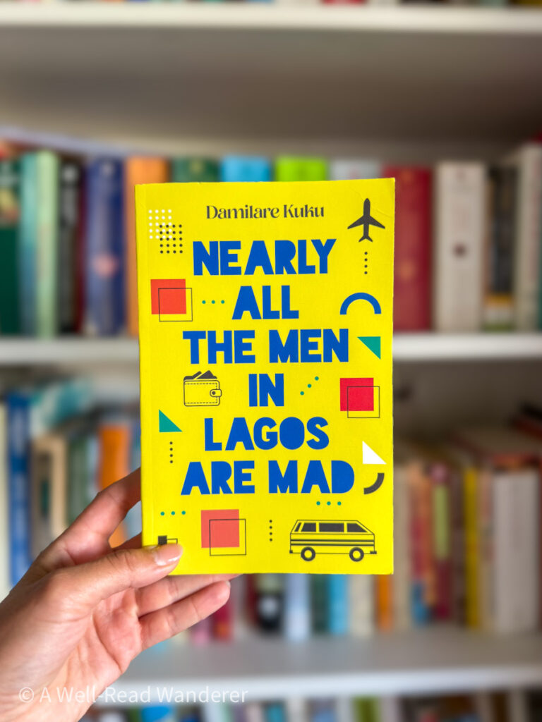 nearly all the men in lagos are mad by demilare kuku, book cover is yellow and held by manicured hand in front of white shelf.